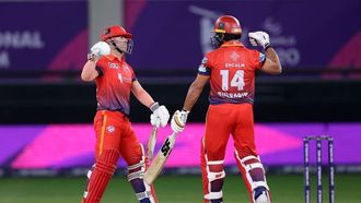 Warner~~s 93 Takes Dubai Capitals To Playoffs