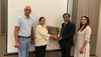 Dr. Potdar Wins Award, Honors Family